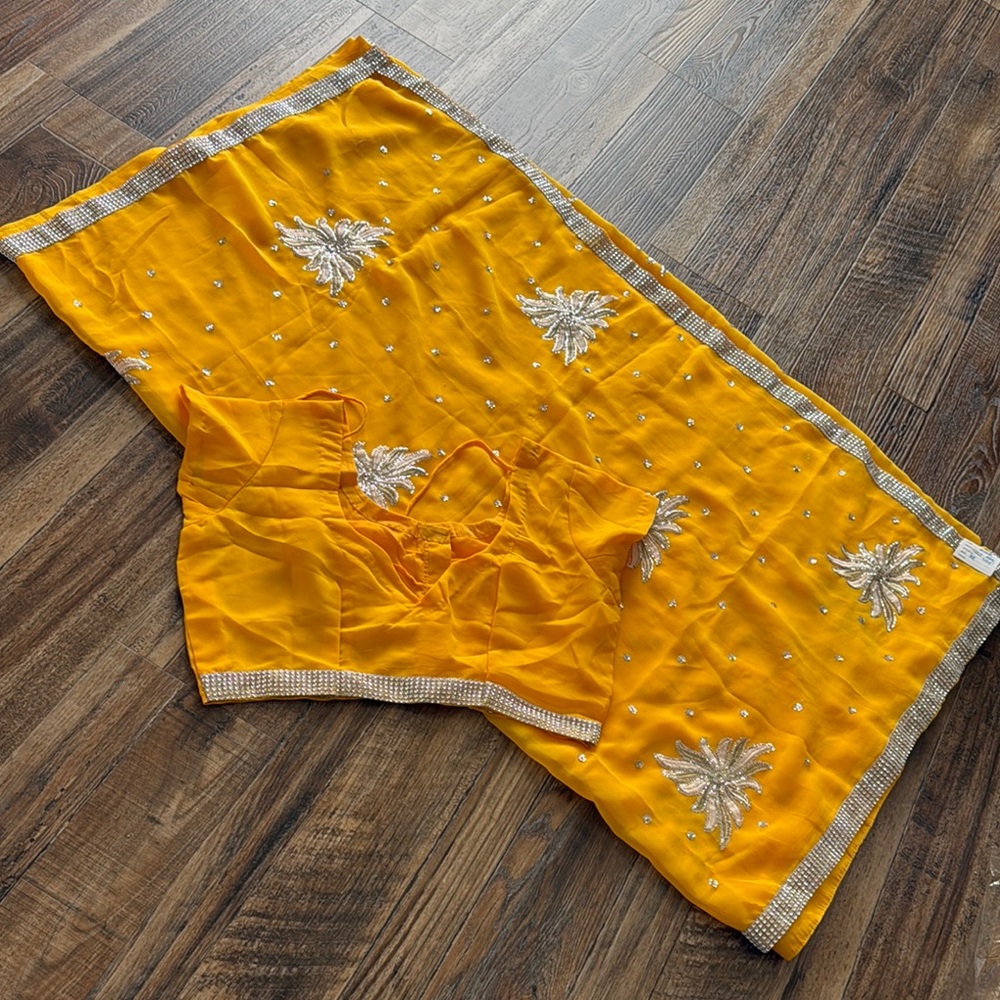 Elegant Yellow Saree with Silver Embellishments